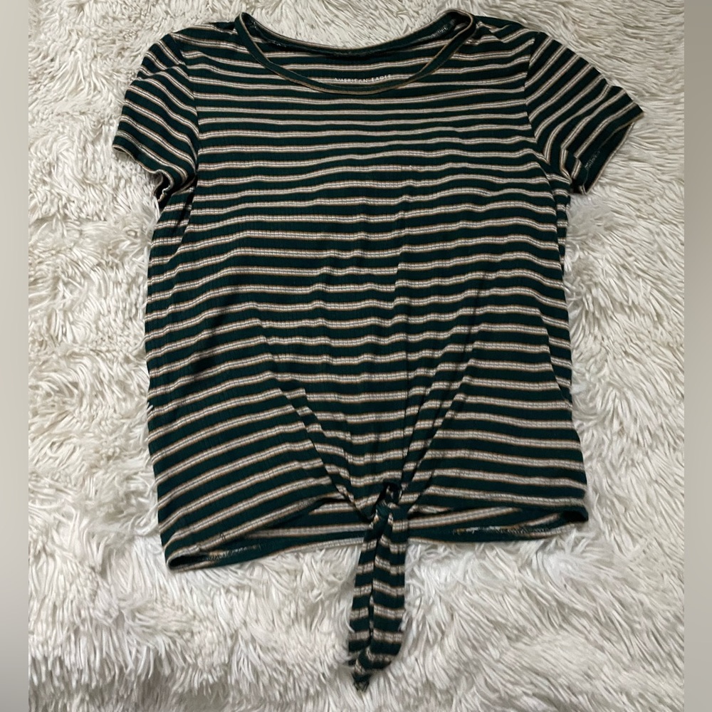 It’s a size XS it’s has a little knot at the bottom , super cute and comfy.